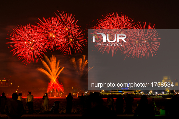 Fireworks illuminate the sky in Doha, Qatar, on November 9, 2024, on the last day of the inaugural Qatar Boat Show 2024 at Old Doha Port. Th...