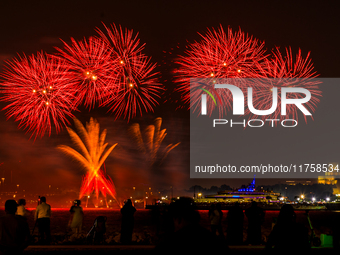 Fireworks illuminate the sky in Doha, Qatar, on November 9, 2024, on the last day of the inaugural Qatar Boat Show 2024 at Old Doha Port. Th...