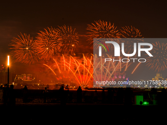 Fireworks illuminate the sky in Doha, Qatar, on November 9, 2024, on the last day of the inaugural Qatar Boat Show 2024 at Old Doha Port. Th...