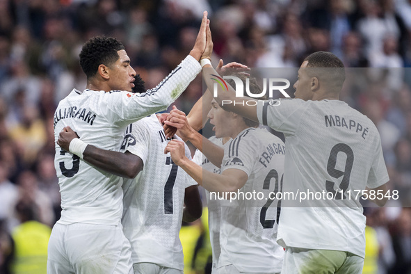 Real Madrid players (from left to right) Jude Bellingham, Vinicius Junior, Fran Garcia, and Kylian Mbappe celebrate a goal during the La Lig...