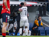 Vinicius Junior of Real Madrid CF hugs Carlo Ancelotti, head coach of Real Madrid CF, during the La Liga EA Sports 2024/25 football match be...