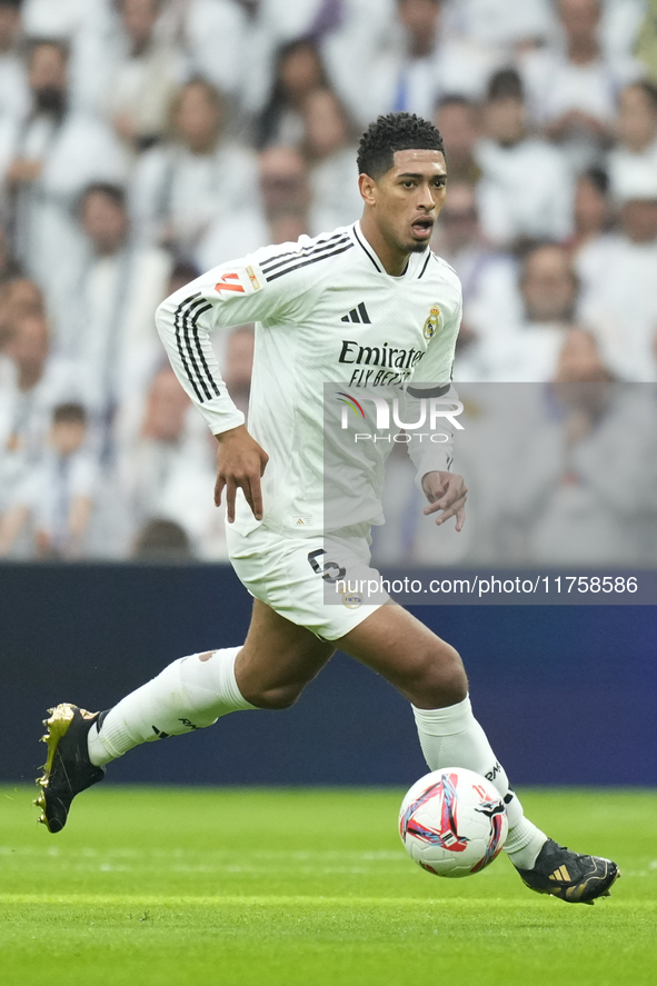 Jude Bellingham central midfield of Real Madrid and England controls the ball during the La Liga match between Real Madrid CF and CA Osasuna...