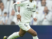 Jude Bellingham central midfield of Real Madrid and England controls the ball during the La Liga match between Real Madrid CF and CA Osasuna...