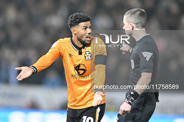 Elias Kachunga (10 Cambridge United) gestures to Referee Edward Duckworth during the Sky Bet League 1 match between Peterborough and Cambrid...