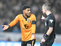 Elias Kachunga (10 Cambridge United) gestures to Referee Edward Duckworth during the Sky Bet League 1 match between Peterborough and Cambrid...