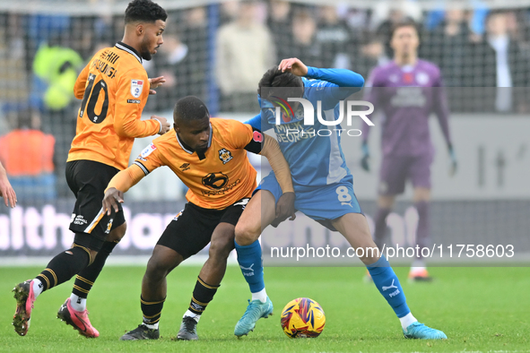 Brandon Njoku (34 Cambridge United) and Ryan De Havilland (8 Peterborough United) battle for the ball during the Sky Bet League 1 match betw...