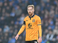 James Brophy (7 Cambridge United) looks on during the Sky Bet League 1 match between Peterborough and Cambridge United at London Road in Pet...