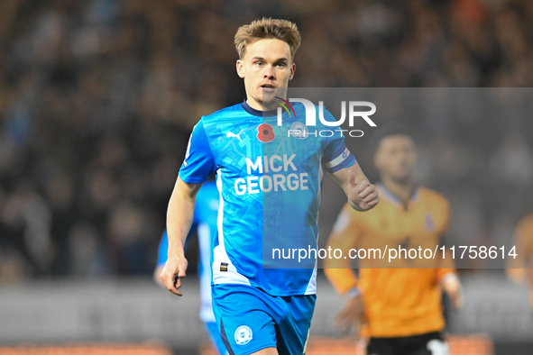 Archie Collins of Peterborough United observes during the Sky Bet League 1 match between Peterborough and Cambridge United in Peterborough,...