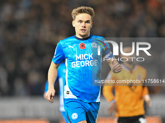 Archie Collins of Peterborough United observes during the Sky Bet League 1 match between Peterborough and Cambridge United in Peterborough,...