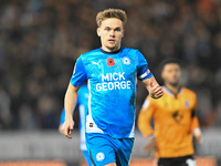 Archie Collins of Peterborough United observes during the Sky Bet League 1 match between Peterborough and Cambridge United in Peterborough,...