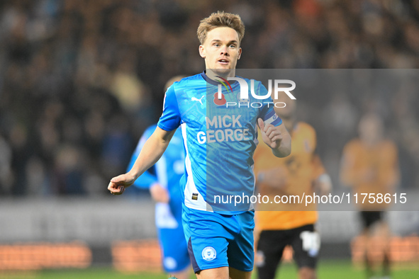 Archie Collins (4 Peterborough United) goes forward during the Sky Bet League 1 match between Peterborough and Cambridge United in Peterboro...