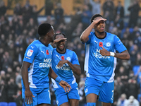 Malik Mothersille (7 Peterborough United) celebrates after scoring the team's fourth goal with Ricky Jade Jones in the center and Kwame Poku...