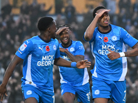 Malik Mothersille (7 Peterborough United) celebrates after scoring the team's fourth goal with Ricky Jade Jones in the center and Kwame Poku...