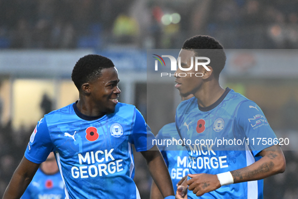 Malik Mothersille (7 Peterborough United) celebrates after scoring the team's fourth goal with Kwame Poku (11 Peterborough United) during th...