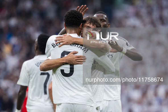 Jude Bellingham of Real Madrid CF celebrates his goal by hugging Raul Asencio of Real Madrid CF during the La Liga EA Sports 2024/25 footbal...