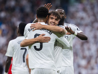 Jude Bellingham of Real Madrid CF celebrates his goal by hugging Raul Asencio of Real Madrid CF during the La Liga EA Sports 2024/25 footbal...