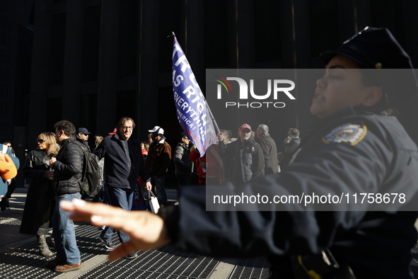 Trump supporters participate in the immigrant protest over imminent changes to immigration reforms in Manhattan, NY, on November 9, 2024. Th...