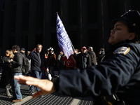 Trump supporters participate in the immigrant protest over imminent changes to immigration reforms in Manhattan, NY, on November 9, 2024. Th...