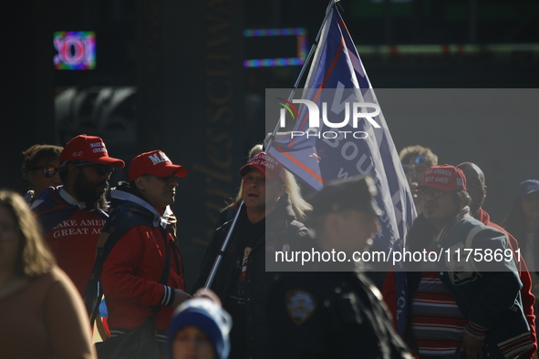 Trump supporters participate in the immigrant protest over imminent changes to immigration reforms in Manhattan, NY, on November 9, 2024. Th...