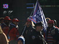 Trump supporters participate in the immigrant protest over imminent changes to immigration reforms in Manhattan, NY, on November 9, 2024. Th...