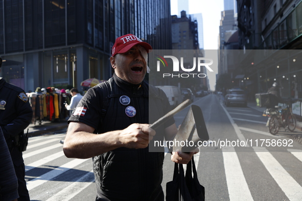 Trump supporters participate in the immigrant protest over imminent changes to immigration reforms in Manhattan, NY, on November 9, 2024. Th...