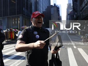 Trump supporters participate in the immigrant protest over imminent changes to immigration reforms in Manhattan, NY, on November 9, 2024. Th...