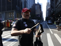 Trump supporters participate in the immigrant protest over imminent changes to immigration reforms in Manhattan, NY, on November 9, 2024. Th...