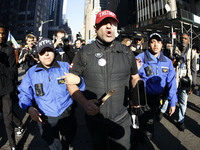 Trump supporters participate in the immigrant protest over imminent changes to immigration reforms in Manhattan, NY, on November 9, 2024. Th...