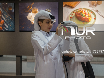 Two young Qatari boys look into the camera during the inaugural Doha Photography Festival 2024 at Darb al-Saai in Umm Salal, Qatar, on Novem...