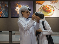 Two young Qatari boys look into the camera during the inaugural Doha Photography Festival 2024 at Darb al-Saai in Umm Salal, Qatar, on Novem...