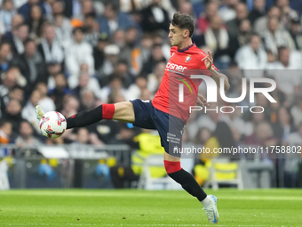 Aimar Oroz attacking midfield of Osasuna and Spain compete for the ball during the La Liga match between Real Madrid CF and CA Osasuna at Es...