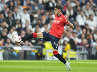 Aimar Oroz attacking midfield of Osasuna and Spain compete for the ball during the La Liga match between Real Madrid CF and CA Osasuna at Es...