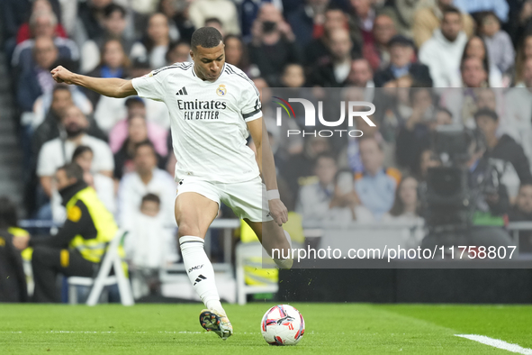 Kylian Mbappe centre-forward of Real Madrid and France shooting to goal during the La Liga match between Real Madrid CF and CA Osasuna at Es...