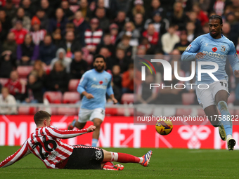 Sunderland's Chris Mepham tackles Coventry City's Haji Wright during the Sky Bet Championship match between Sunderland and Coventry City at...