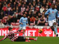 Sunderland's Chris Mepham tackles Coventry City's Haji Wright during the Sky Bet Championship match between Sunderland and Coventry City at...