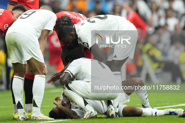 Eder Militao centre-back of Real Madrid and Brazil dejected lies injured on the pitch during the La Liga match between Real Madrid CF and CA...