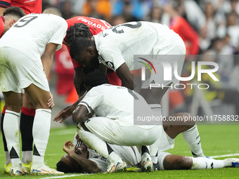 Eder Militao centre-back of Real Madrid and Brazil dejected lies injured on the pitch during the La Liga match between Real Madrid CF and CA...