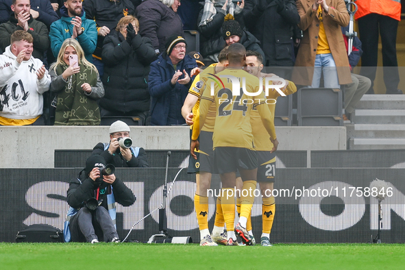 Pablo Sarabia of Wolves (right) receives congratulations for his goal during the Premier League match between Wolverhampton Wanderers and So...