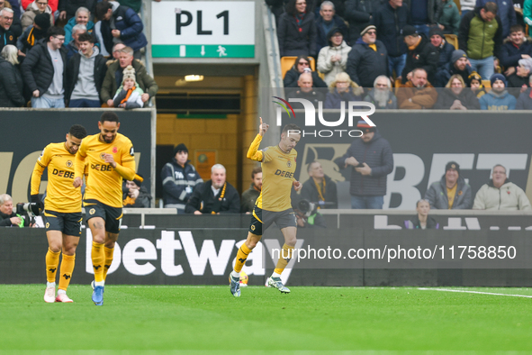 Pablo Sarabia of Wolves raises his hand in celebration following his goal during the Premier League match between Wolverhampton Wanderers an...