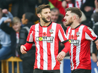 #10, Adam Lallana, and #3, Ryan Manning of Southampton participate in the Premier League match between Wolverhampton Wanderers and Southampt...