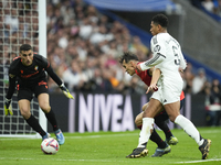 Jude Bellingham central midfield of Real Madrid and England and Ante Budimir centre-forward of Osasuna and Croatia compete for the ball duri...