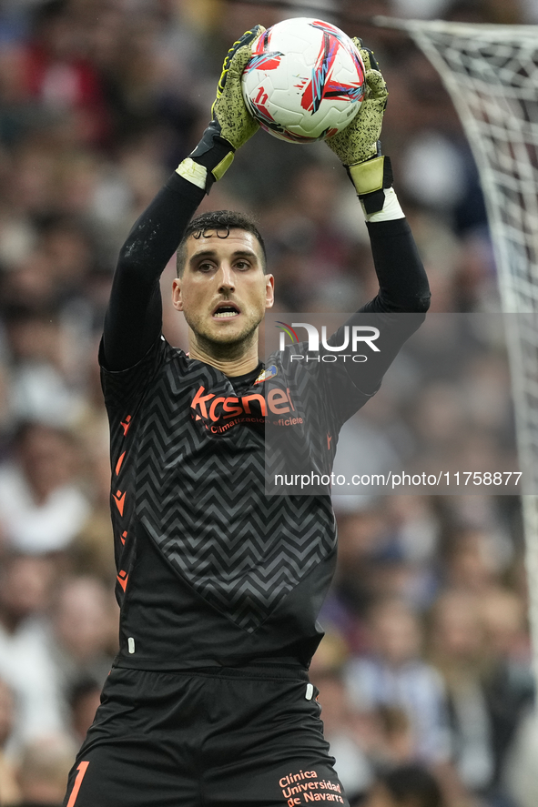 Sergio Herrera goalkeeper of Osasuna and Spain makes a save during the La Liga match between Real Madrid CF and CA Osasuna at Estadio Santia...