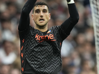 Sergio Herrera goalkeeper of Osasuna and Spain makes a save during the La Liga match between Real Madrid CF and CA Osasuna at Estadio Santia...