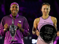 RIYADH, SAUDI ARABIA - NOVEMBER 09: Coco Gauff of USA and Quinwen Zheng of China pose for a photo with their Trophy after the Final, on Day...