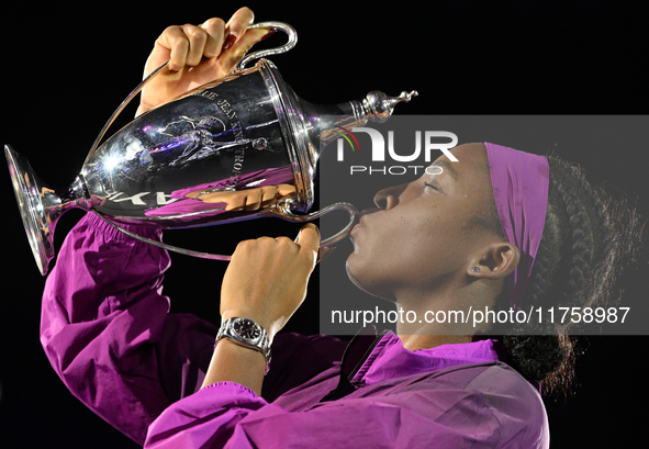 RIYADH, SAUDI ARABIA - NOVEMBER 09: Coco Gauff of USA celebrates with the Official Trophy after winning the Final match against Quinwen Zhen...