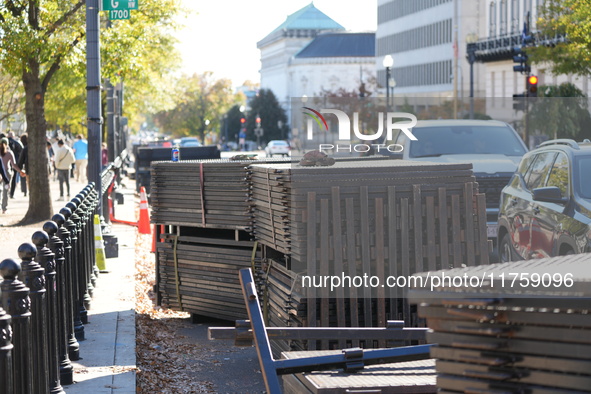 Security officials remove riot fences from around the White House complex in Washington, D.C., United States, on November 9, 2024. The fence...