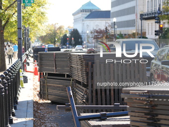 Security officials remove riot fences from around the White House complex in Washington, D.C., United States, on November 9, 2024. The fence...