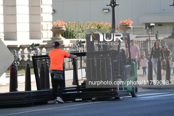 Security officials remove riot fences from around the White House complex in Washington, D.C., United States, on November 9, 2024. The fence...