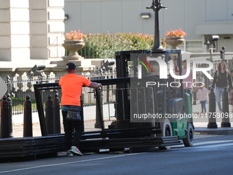 Security officials remove riot fences from around the White House complex in Washington, D.C., United States, on November 9, 2024. The fence...