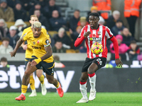 Mario Lemina of Wolves and Lesley Ugochukwu of Southampton fight for possession during the Premier League match between Wolverhampton Wander...